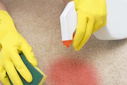 Glossy Cleaners team cleaning a hardwood floor
