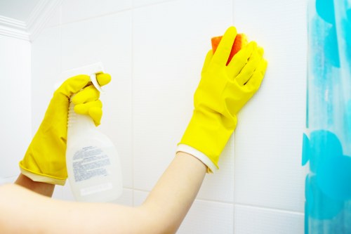 Glossy Cleaners team meticulously cleaning floors in a renovated space