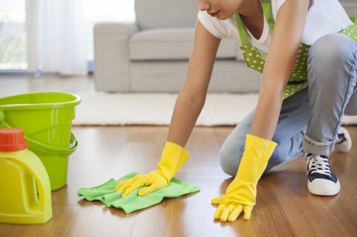 Glossy Cleaners team cleaning a modern kitchen